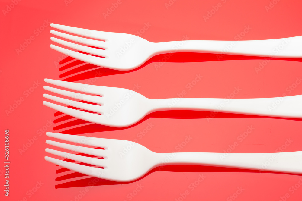 Plastic fork for casual food. White fork. Plastic fork for casual food. White fork.