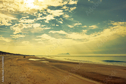 Panoramic view of a beach at sunset.