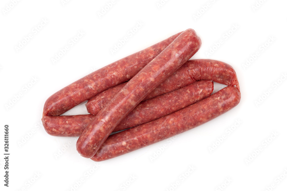 Raw sausages on a white background. Grilled sausages close-up on a white background. Raw sausages on a white background. Grilled sausages close-up on a white background.