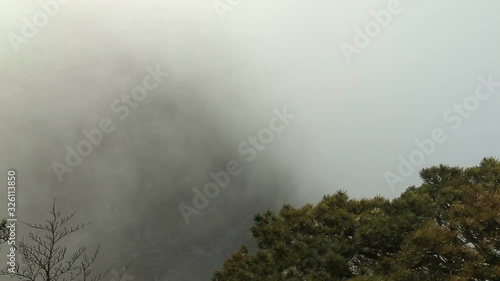 Mist, clouds rising in Huangshan national park, (Yellow Mountain) Anhui Porvince, China. photo