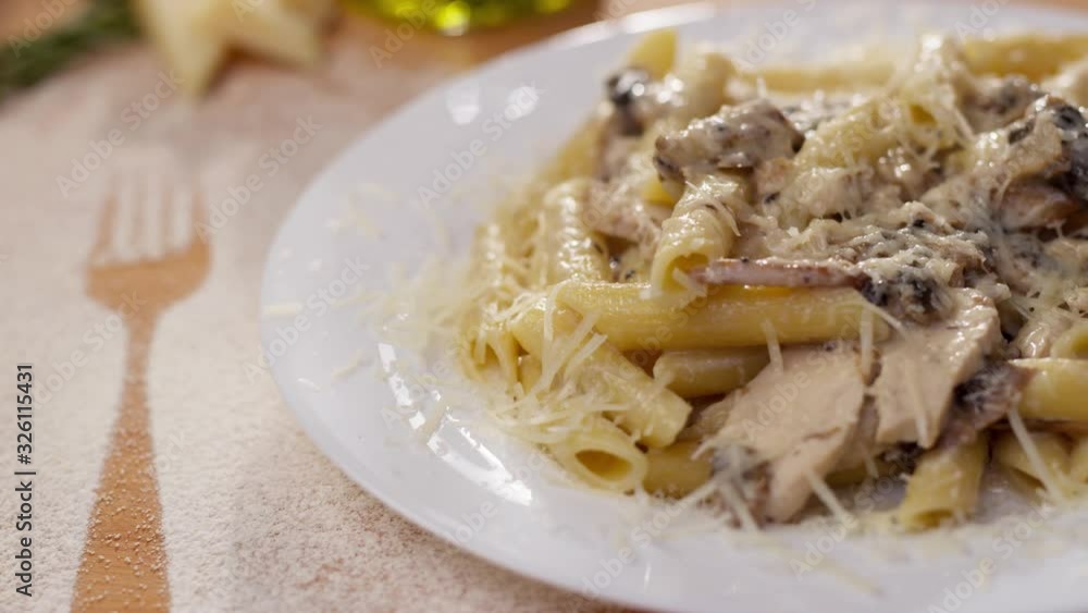 Appetizing shot of tasty Italian pasta made with mushrooms and parmesan cheese served at a restaurant. Delicious meal. Traditional cuisine. Healthy eating, travel, aesthetics concept Appetizing shot of tasty Italian pasta made with mushrooms and parmesan cheese served at a restaurant. Delicious meal. Traditional cuisine. Healthy eating, travel, aesthetics concept