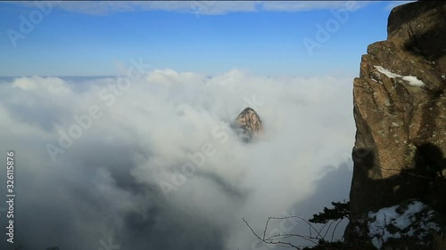 Mist, clouds rising in Huangshan national park, (Yellow Mountain) Anhui Porvince, China. photo