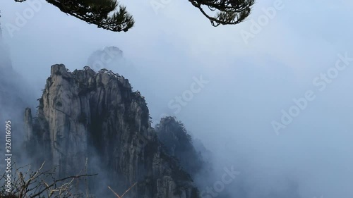 Mist, clouds rising in Huangshan national park, (Yellow Mountain) Anhui Porvince, China. photo