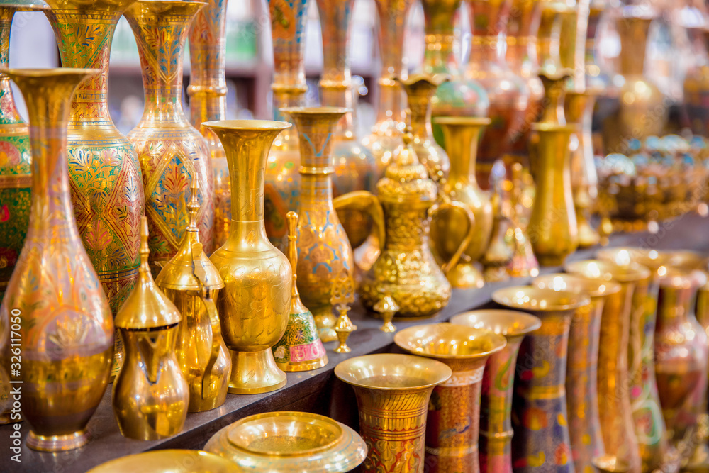 Fototapeta premium Typical traditional souvenir jugs in the store for tourists, painted with glaze.