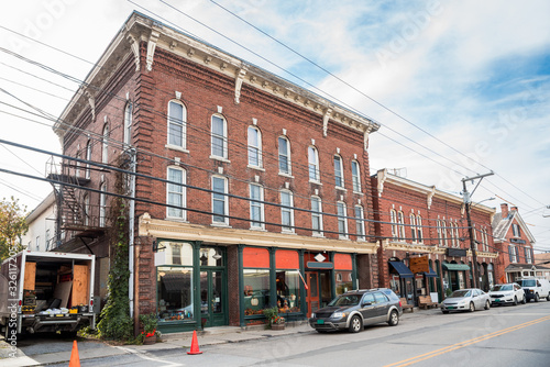 Old American brick buildings with stores on the ground floor along a street in a mountain town photo