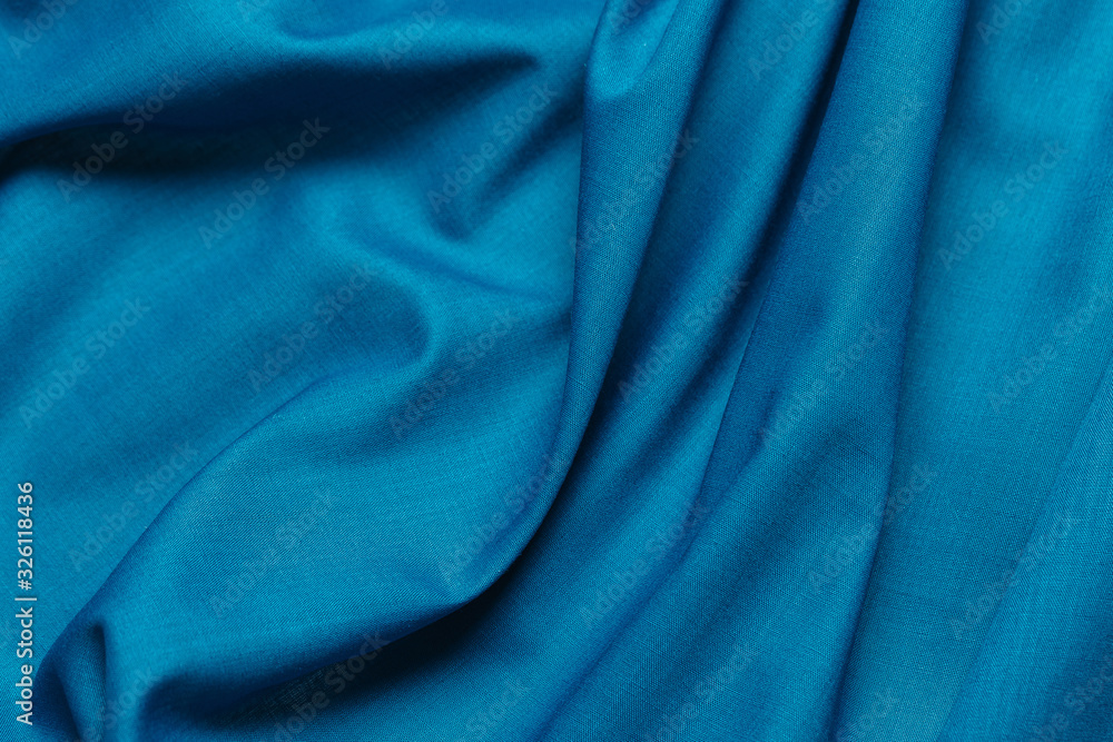 Fototapeta premium Blue fabric cloth texture. abstract texture background with soft waves.