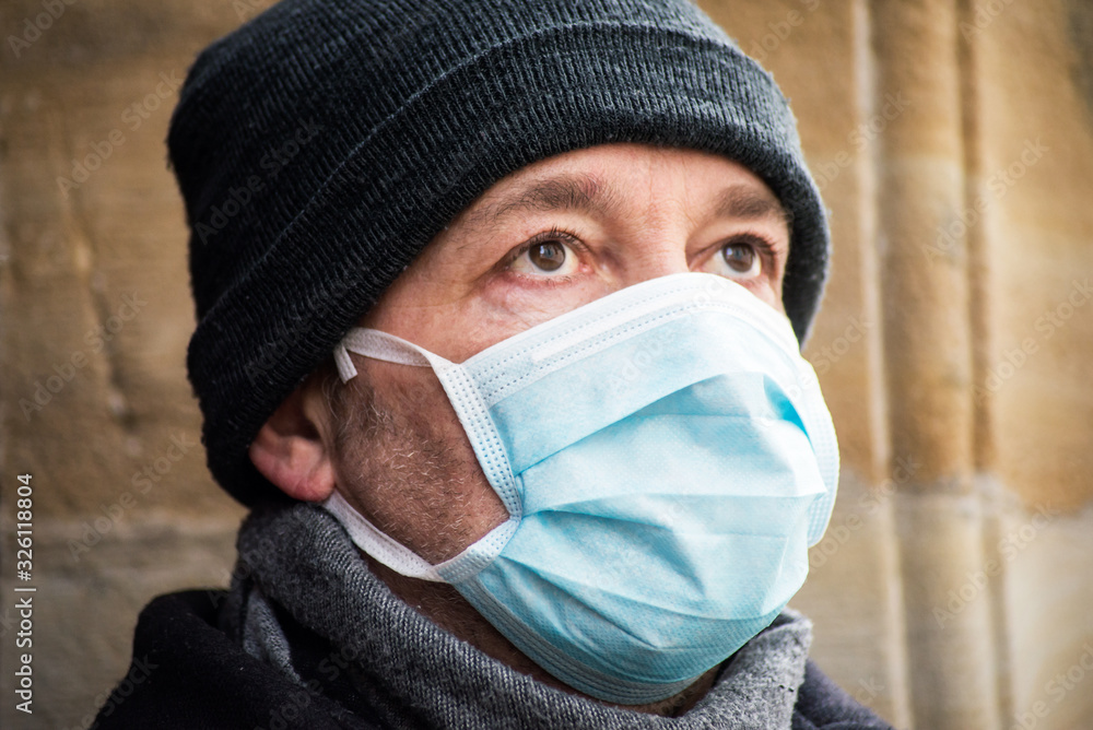 Portrait of man with medical mask to protect against the corona virus in the street Portrait of man with medical mask to protect against the corona virus in the street