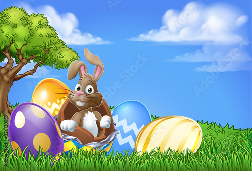 Easter bunny rabbit breaking out of a chocolate Easter egg background cartoon