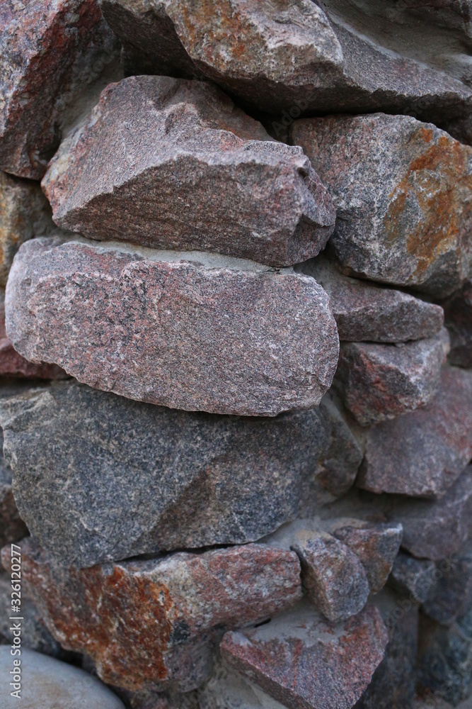  large brown stones, texture, outdoors in summer