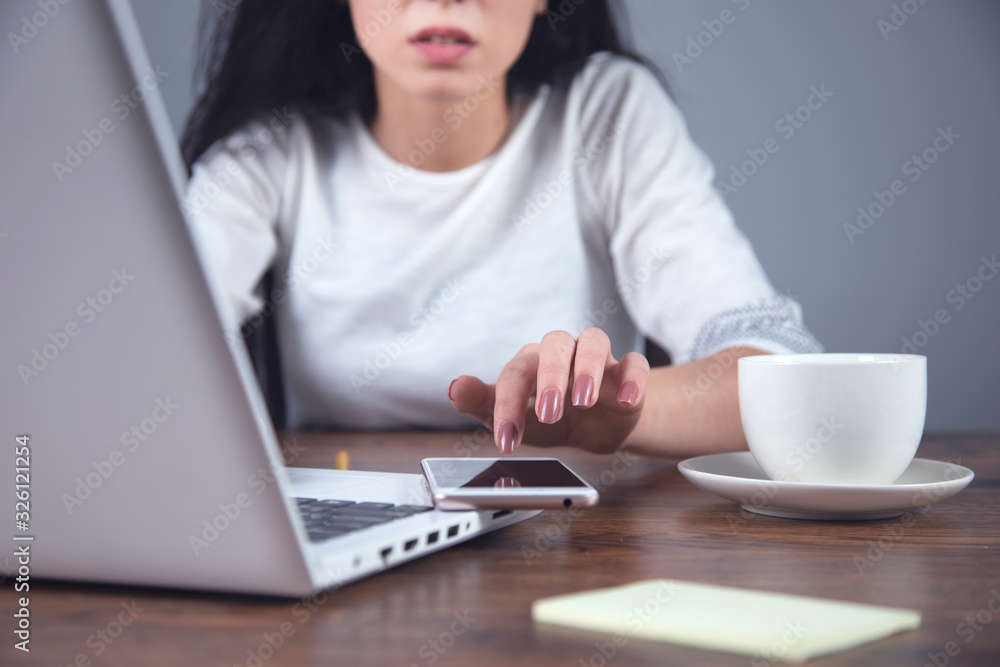 woman hand phone with coffee and computer woman hand phone with coffee and computer
