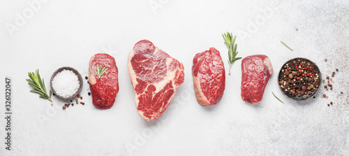 Variety of raw beef steaks photo