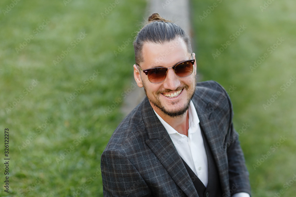 portrait of a fashionable guy in a suit portrait of a fashionable guy in a suit