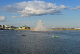 August 18, 2013: People ride catamarans and boats around the fountain. Cheboksary. Russia.