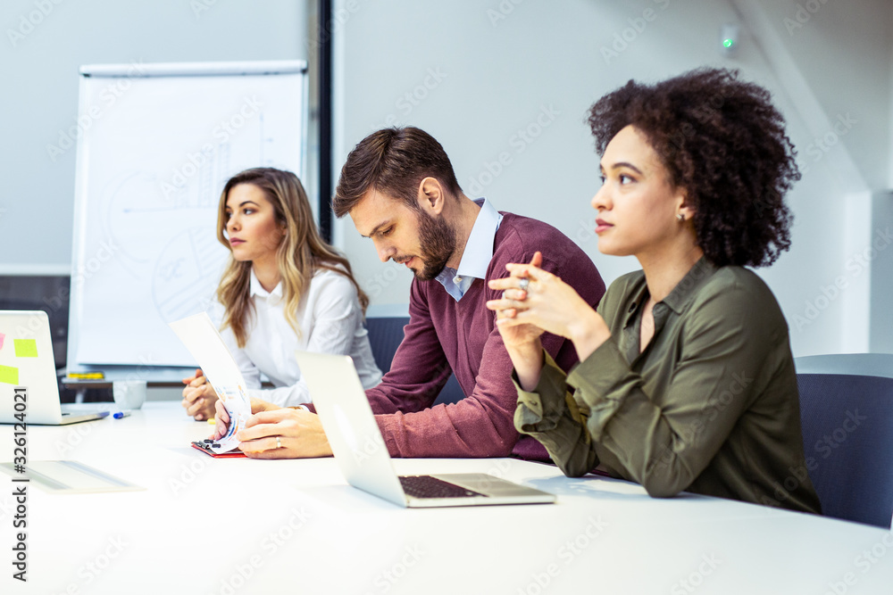 © zorandim75 - Group of business people having meeting together. © zorandim75 - Group of business people having meeting together.