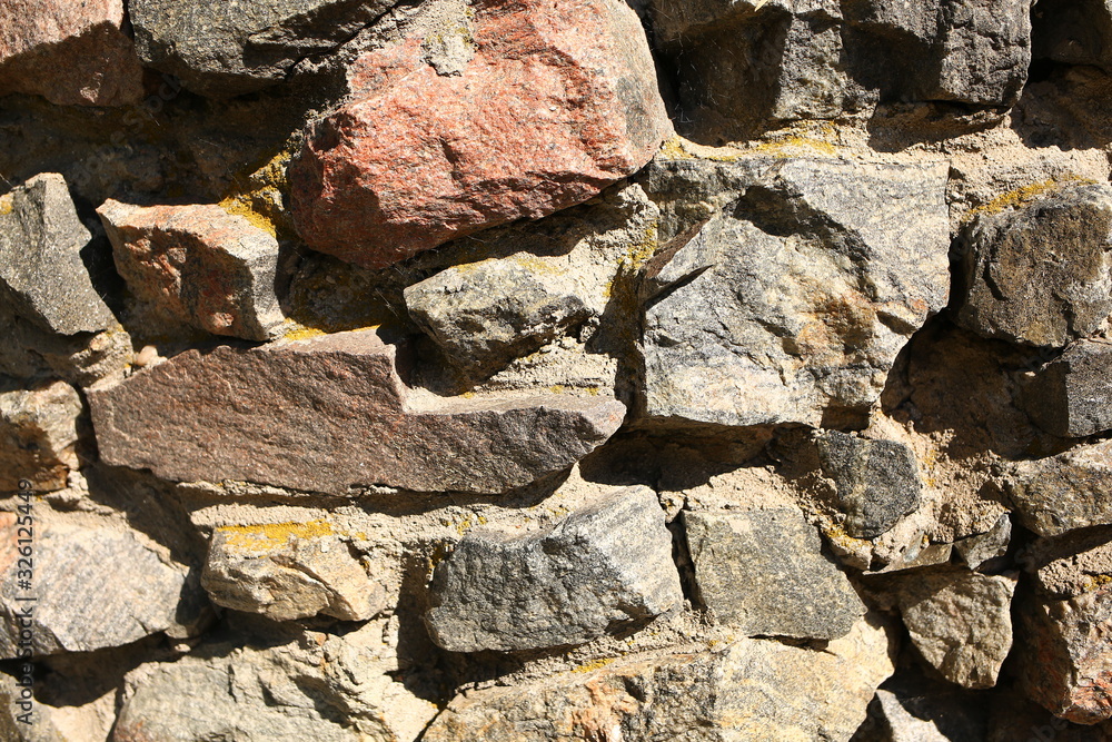 Fototapeta premium brown stones, texture, outdoors in summer