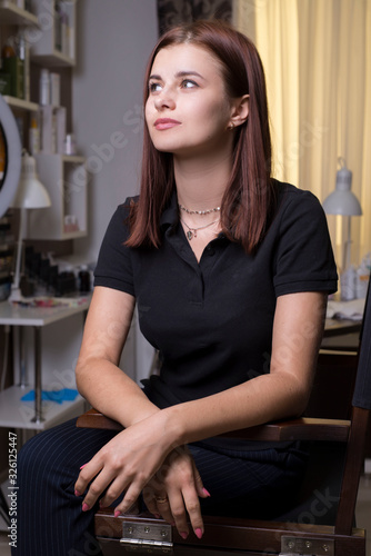 portrait of a young beautiful girl, with flawless skin, in a beauty salon. Makeup master at the workplace. © Алексей Доненко