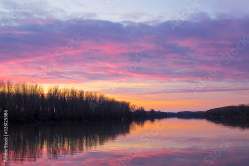 Magic colors of sunset over the Tisa river Serbia