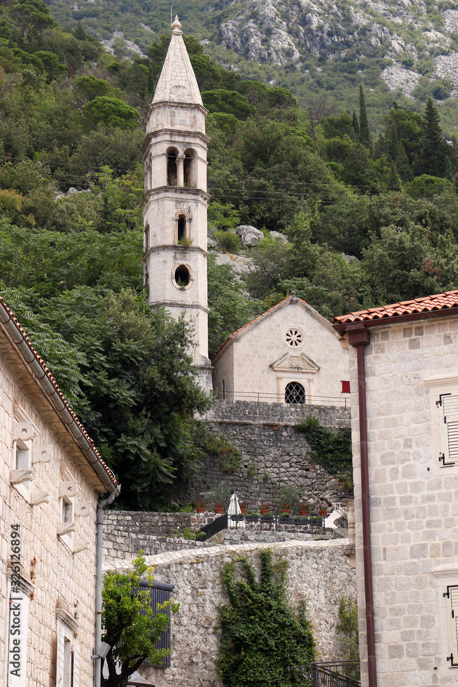 old stone houses and stone church tower Perast town Montenegro