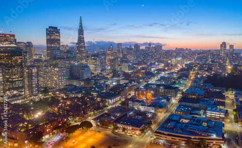 San Francisco downtown skyline at twilight aerial view. Blue and orange sky with crescent moon. 