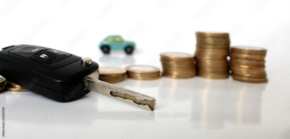 Miniature people with coins and car. Miniature businessman walking through a toy car. Concept of financial, retail, money saving and business. Turkey car price infilation. Car mortgage related Miniature people with coins and car. Miniature businessman walking through a toy car. Concept of financial, retail, money saving and business. Turkey car price infilation. Car mortgage related