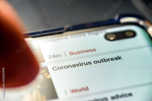 coronavirus outbrake text on smart phone screen photo