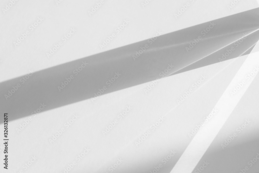 Blurred overlay effect for photo and mockups. Organic drop diagonal shadow and rays of light from window on a white wall. Blurred overlay effect for photo and mockups. Organic drop diagonal shadow and rays of light from window on a white wall.