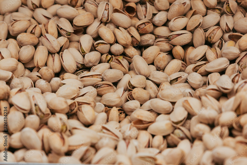 Stock photo of a close shot of pistachios in a market stand