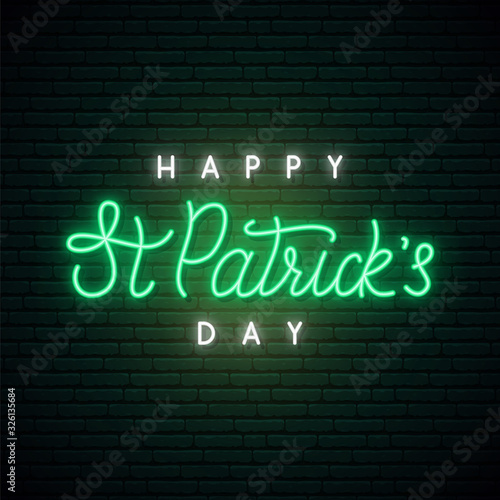 Saint Patrick’s Day neon sign. Shiny lettering Happy St. Patrick’s Day on dark brick wall background. Stock vector illustration..