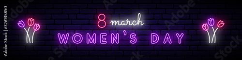 Happy women’s day neon signboard. Bright light inscription with tulip flowers on dark brick wall background. Festive vector banner.8 Mary