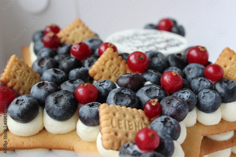 Nice delicious cake with red currant, blueberries, crackers and yummy taste Nice delicious cake with red currant, blueberries, crackers and yummy taste