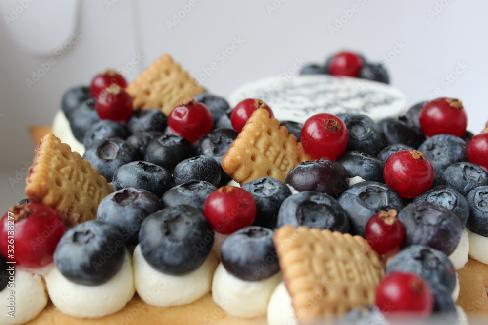 Beautiful cake with fresh berries and good wishes for happy celebration Beautiful cake with fresh berries and good wishes for happy celebration