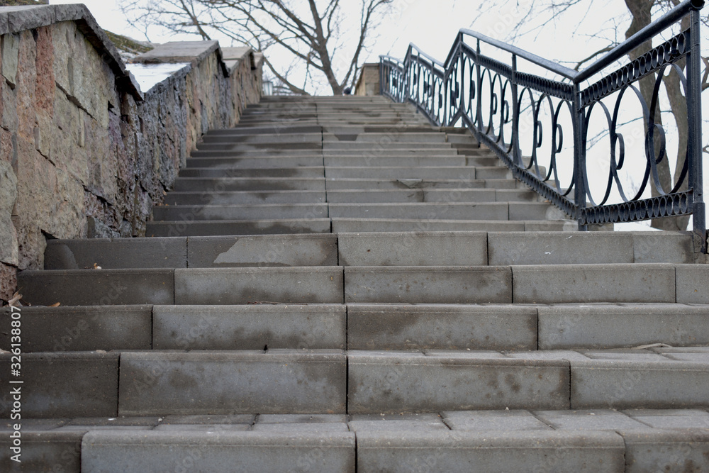 Obraz premium Stone stairs on the promenade of the city.