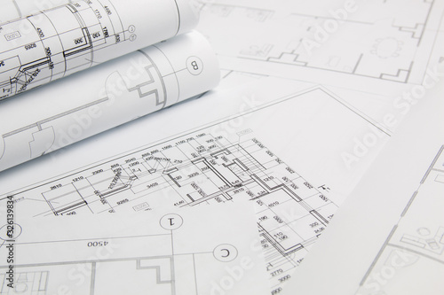 Paper architectural drawings and blueprints