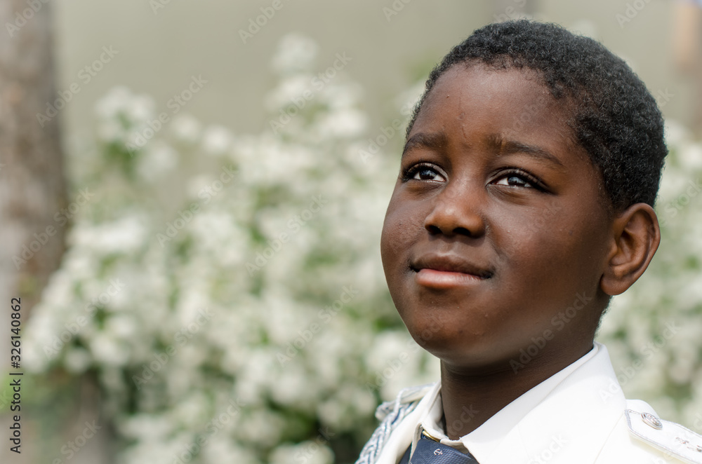 Portrait of black child dressed in first communion Portrait of black child dressed in first communion