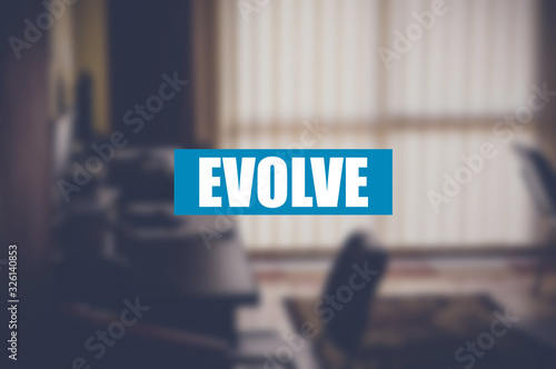 evolve word with business blurring background