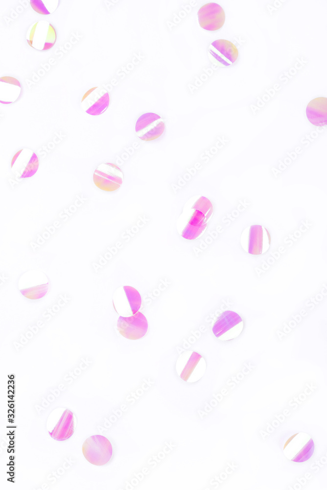 Pearl confetti on white background. Flat lay, top view.