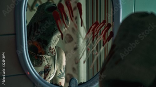 Φωτογραφία Maniac with a knife from a horror movie in the bathroom, horror