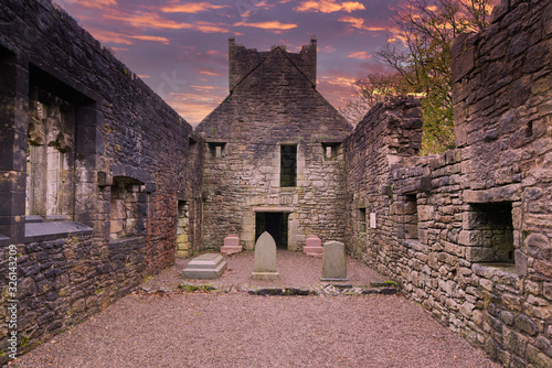 Inside the Old  Semple Ruins at sunset with blazing red sky in Renfrewshire Scotland photo