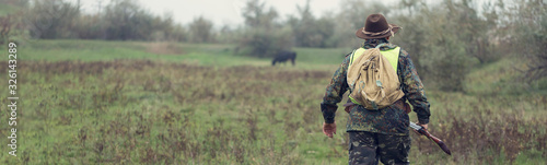 Photography Hunters with a german drathaar and spaniel, pigeon hunting with dogs in reflective vests