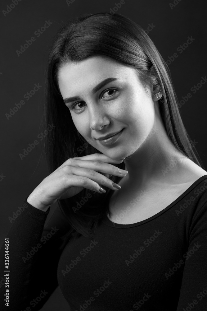 Beauty portrait of a young beautiful brunette girl. Black and white photo. Beauty portrait of a young beautiful brunette girl. Black and white photo.