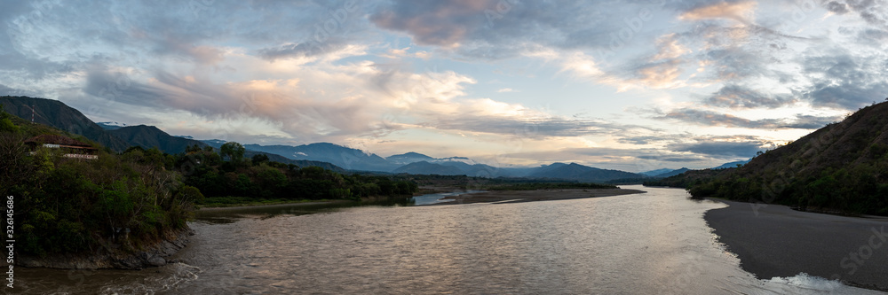 Panoramic View of the Cauca River Between the Santa Fe City of and Olaya City, Surrounded by Mountains and Lots of Vegetation
