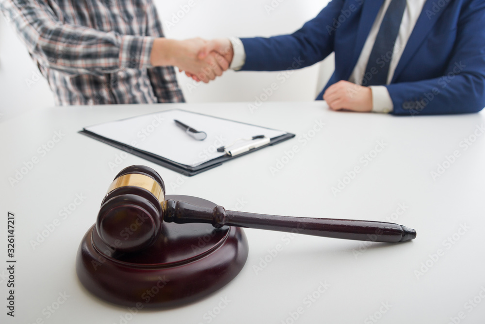 Law, advice and Legal services concept. Lawyer and attorney having team meeting at law firm. Law, advice and Legal services concept. Lawyer and attorney having team meeting at law firm.