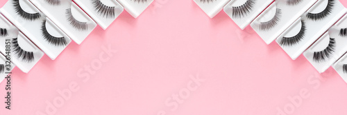 Canvas Print Different fake eyelashes on a trendy pastel pink background