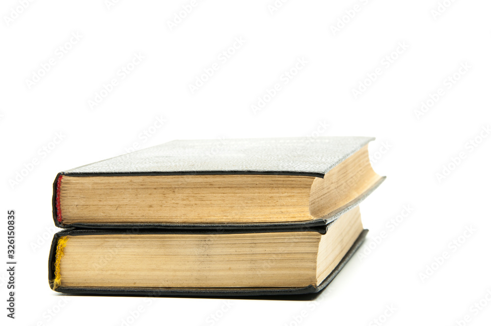 Closed books on the table .. Bible. On a white background. Stack of books Closed books on the table .. Bible. On a white background. Stack of books