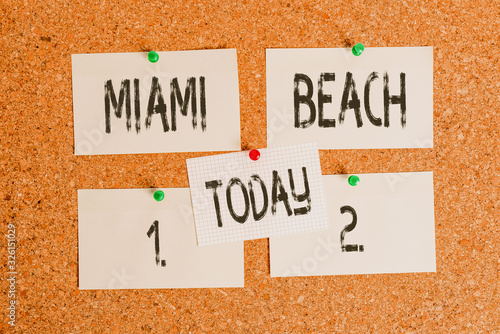 Conceptual hand writing showing Miami Beach. Concept meaning the coastal resort city in MiamiDade County of Florida Corkboard size paper thumbtack sheet billboard notice board photo