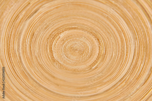 Texture of a round ornament on a wooden board, rotation background with a wood pattern