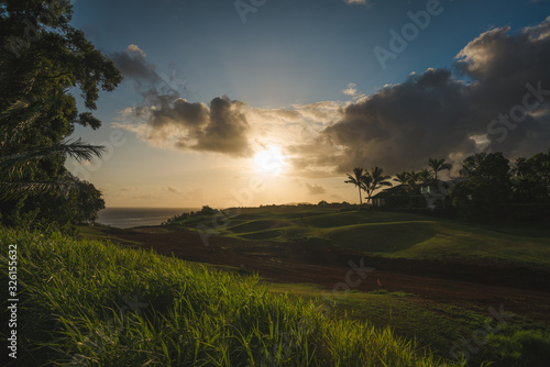 sunrise over green field in Kauai  Hawaii