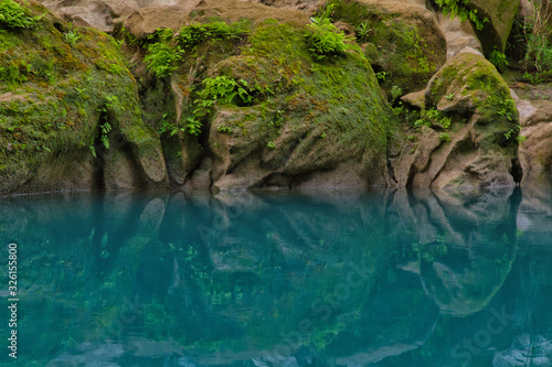 Amazing crystalline blue water of Tamul waterfall, Close up view of spectacular Tamul River,at Huasteca Potosina in San Luis Potosi, Mexico
