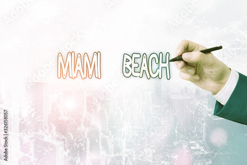 Conceptual hand writing showing Miami Beach. Concept meaning the coastal resort city in MiamiDade County of Florida photo