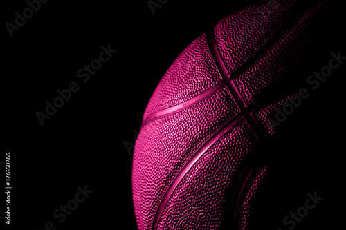 Closeup detail of basketball ball texture background. Pink filter Banner Art concept